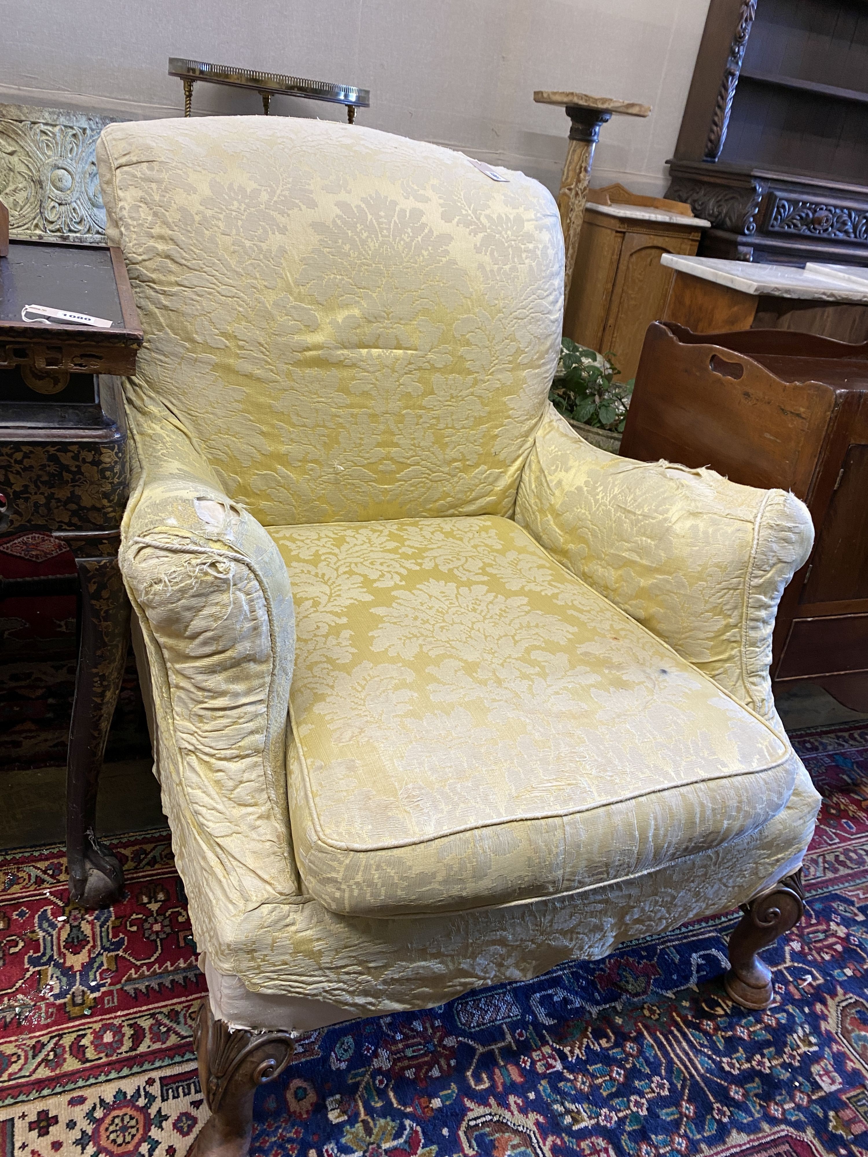 A George I design upholstered armchair on carved cabriole legs, width 79cm, depth 84cm, height 94cm